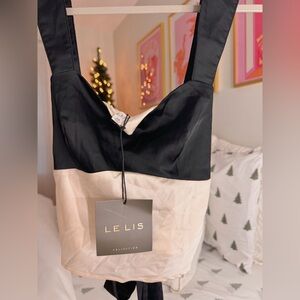 le lis cream and black bow top